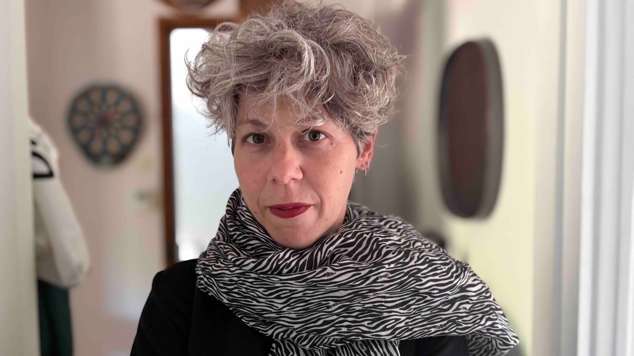Valia Blesiou wearing a black and white patterned scarf